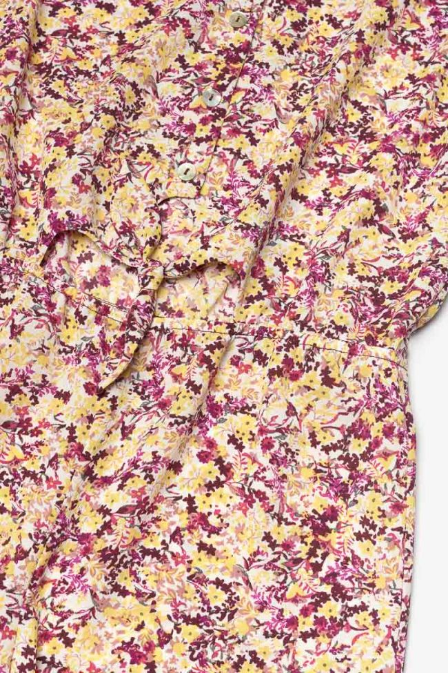 Jumpsuit Yogagi mit rosa und gelbem Blumenmuster.